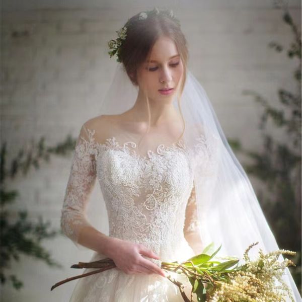 Sheer Crew Neck a line wedding dress Sexy See Through Button Back Long Sleeves Appliques New Vintage Lace Wed Dresses Vestios De Novia Bridal Gown 2023
